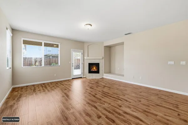 a view of a kitchen and an empty room