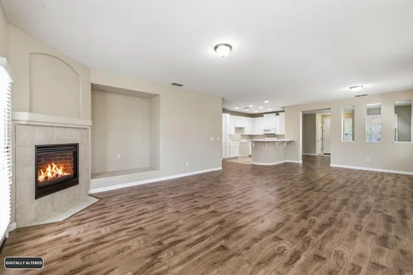 a kitchen with kitchen island a sink appliances and cabinets
