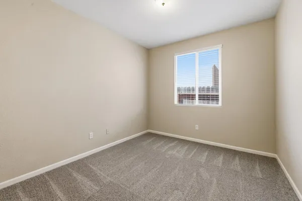 a bedroom with a large bed and a couch