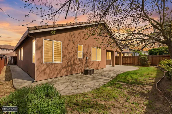 a view of empty room with wooden floor and windows