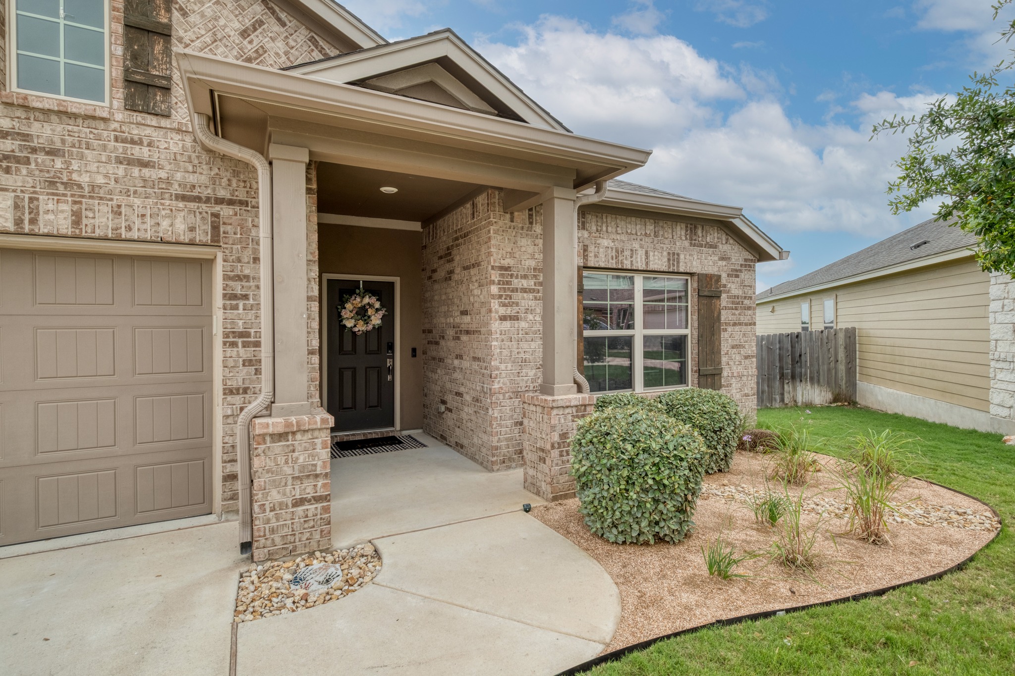 1000 Bright Star Cove Georgetown, TX 78628 - Photo 3 of 40 a front view of a house with garden