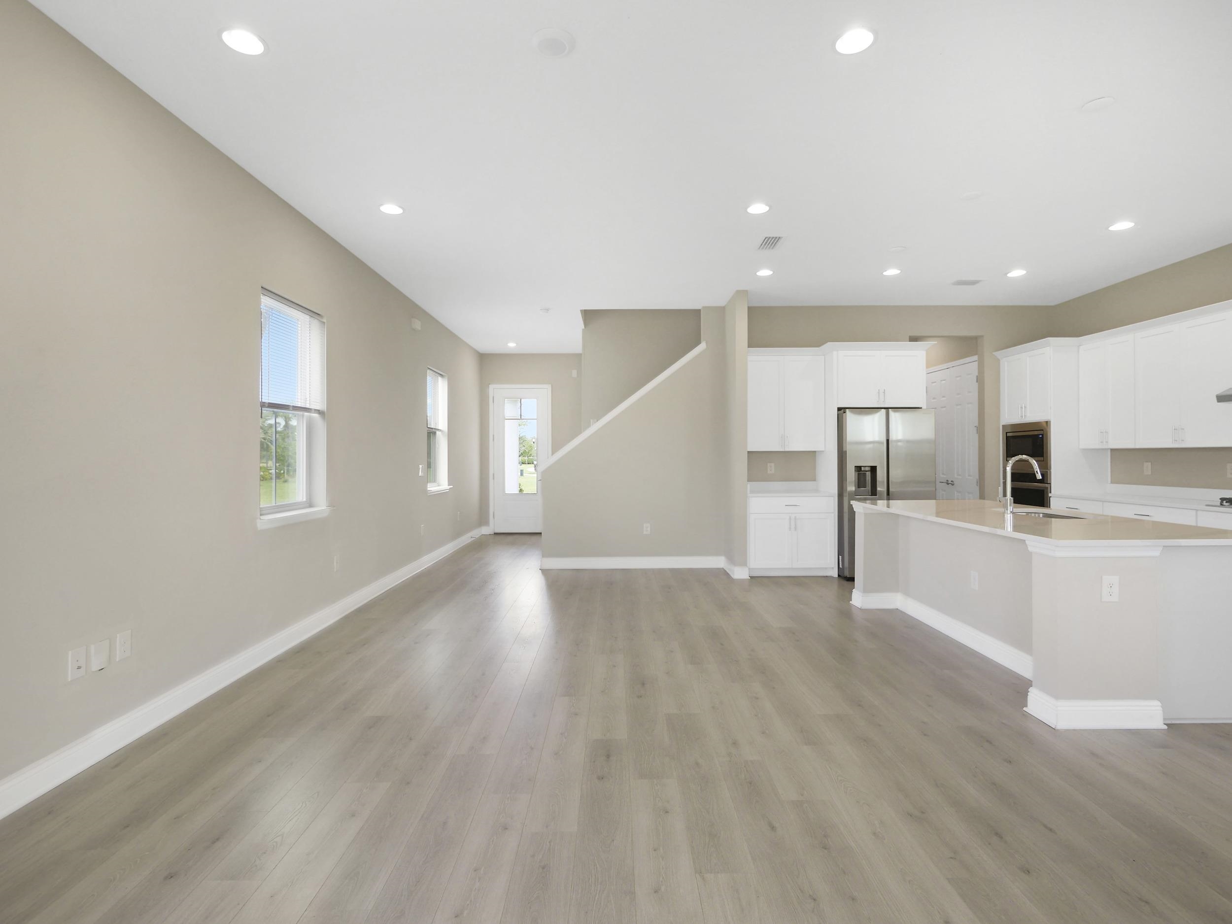 471 Rum Runner Way St. Johns, FL 32259 - Photo 16 of 42 a view of a kitchen with wooden floor and electronic appliances