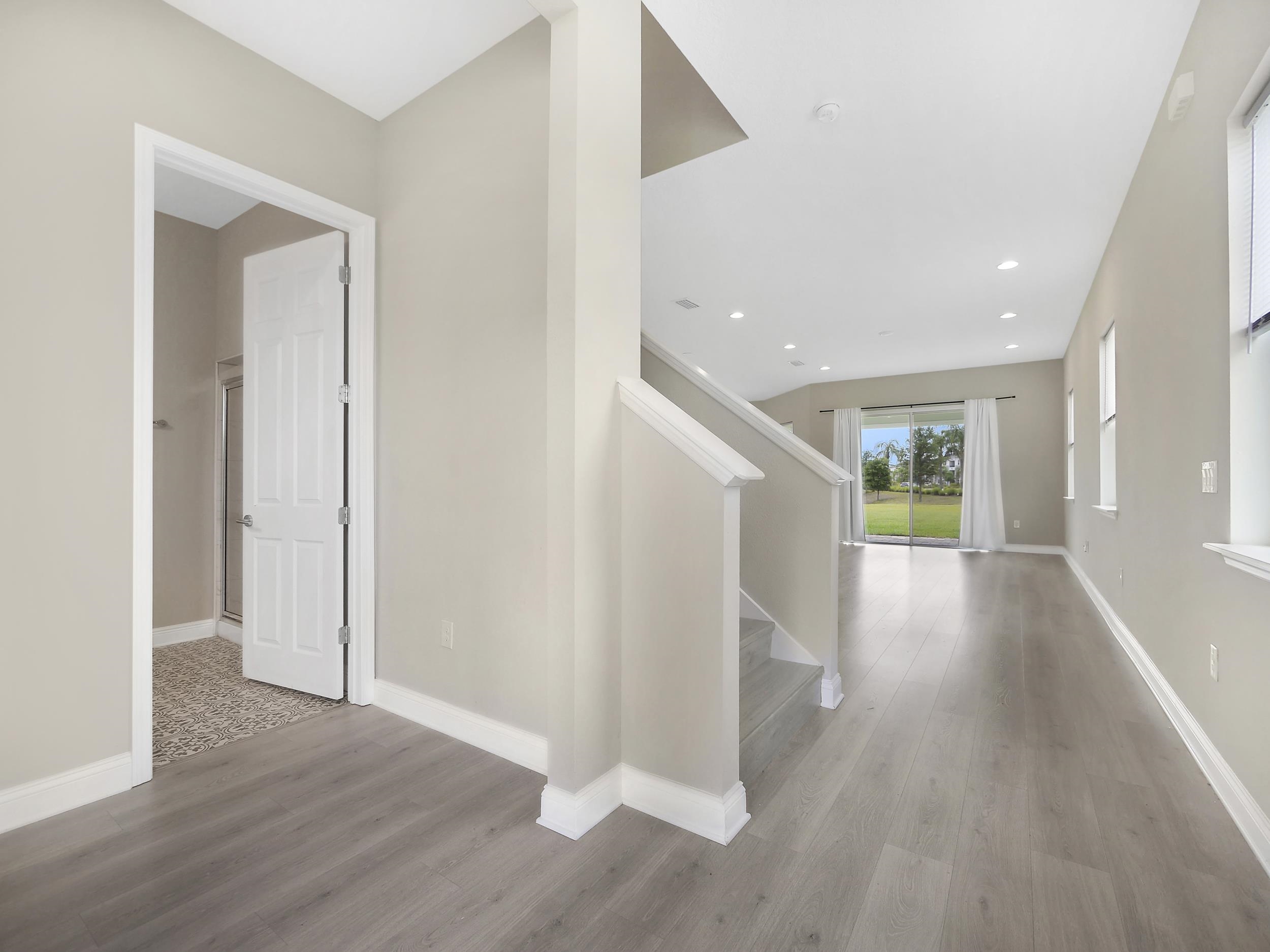 471 Rum Runner Way St. Johns, FL 32259 - Photo 17 of 42 a view of a hallway with wooden floor