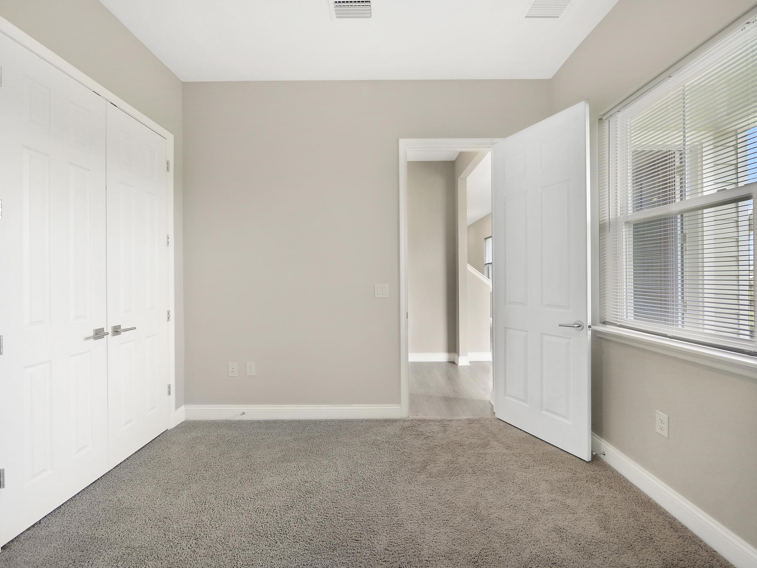 471 Rum Runner Way St. Johns, FL 32259 - Photo 19 of 42 a view of an empty room with a window