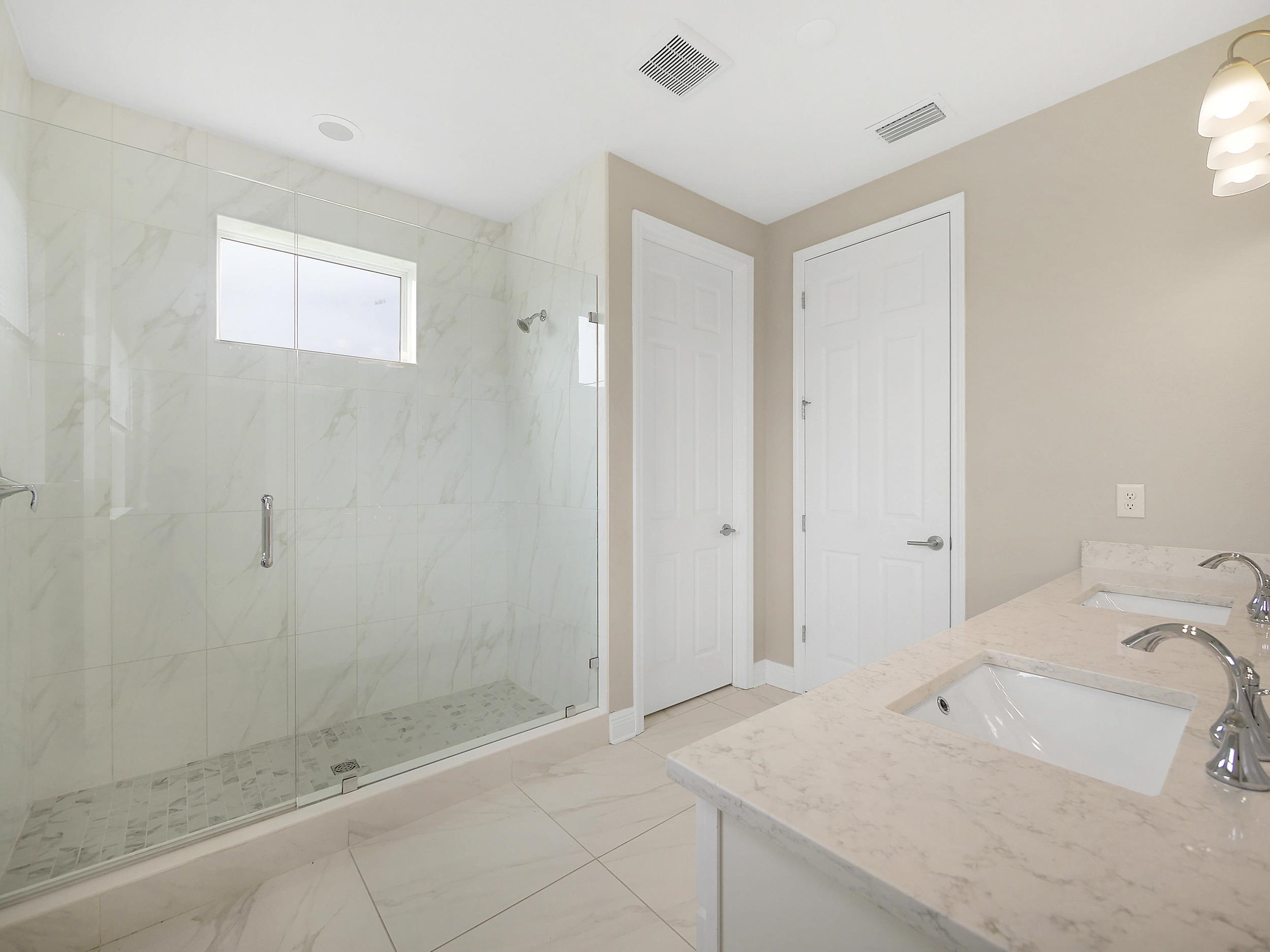 471 Rum Runner Way St. Johns, FL 32259 - Photo 25 of 42 a bathroom with a sink and a shower