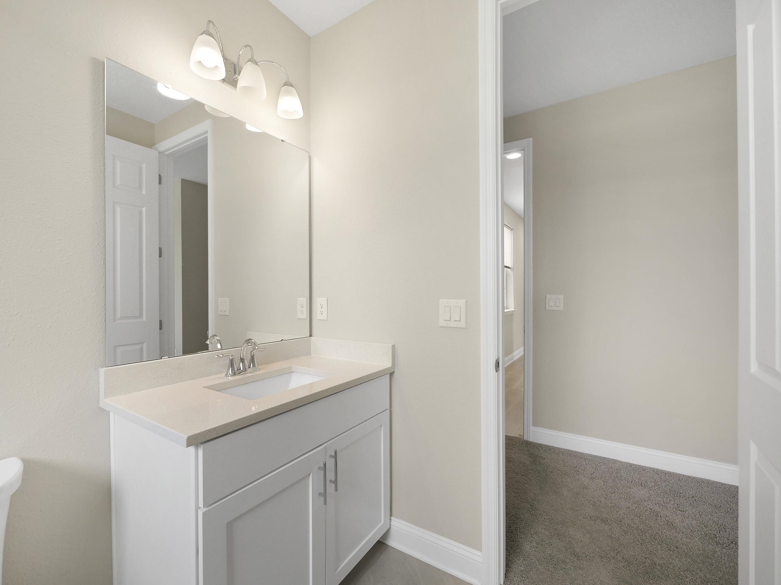 471 Rum Runner Way St. Johns, FL 32259 - Photo 29 of 42 a bathroom with a sink vanity and a mirror
