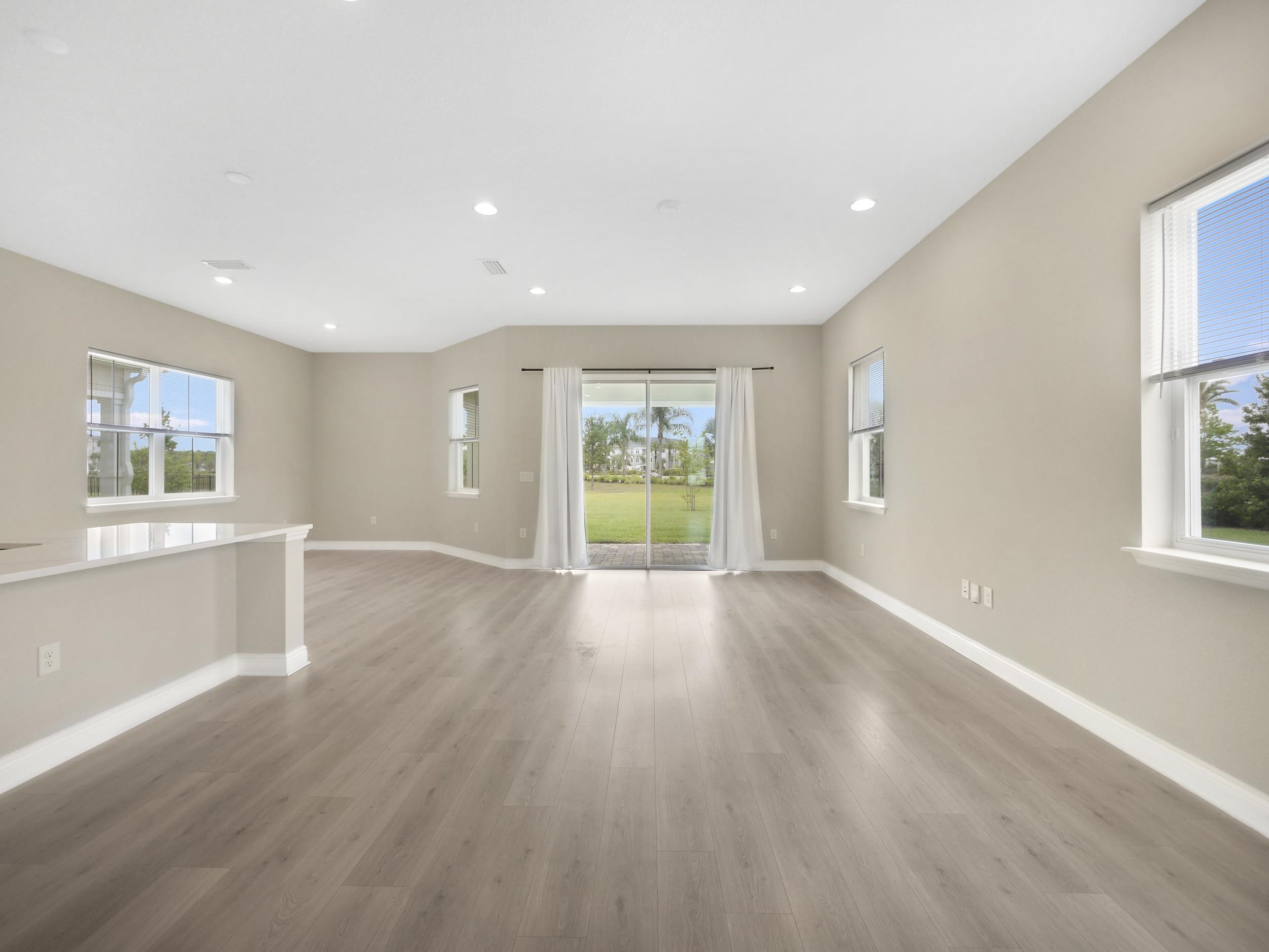 471 Rum Runner Way St. Johns, FL 32259 - Photo 35 of 42 a view of an empty room with wooden floor and fan