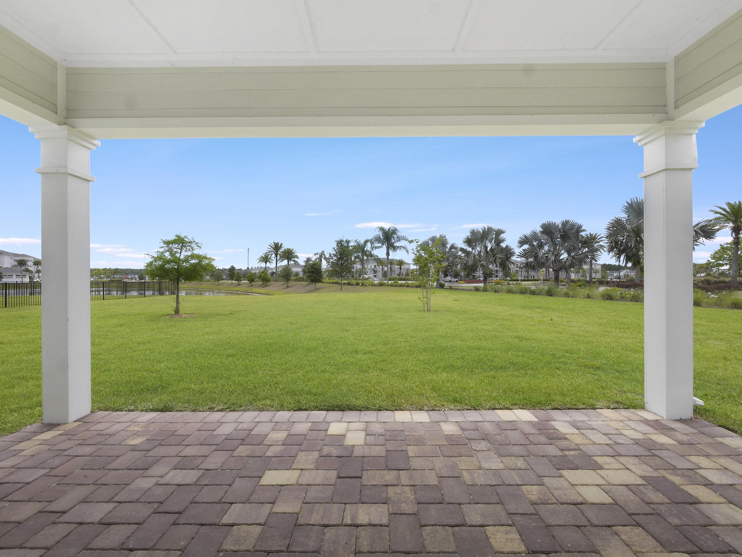 471 Rum Runner Way St. Johns, FL 32259 - Photo 37 of 42 a view of a garden with a building in the background