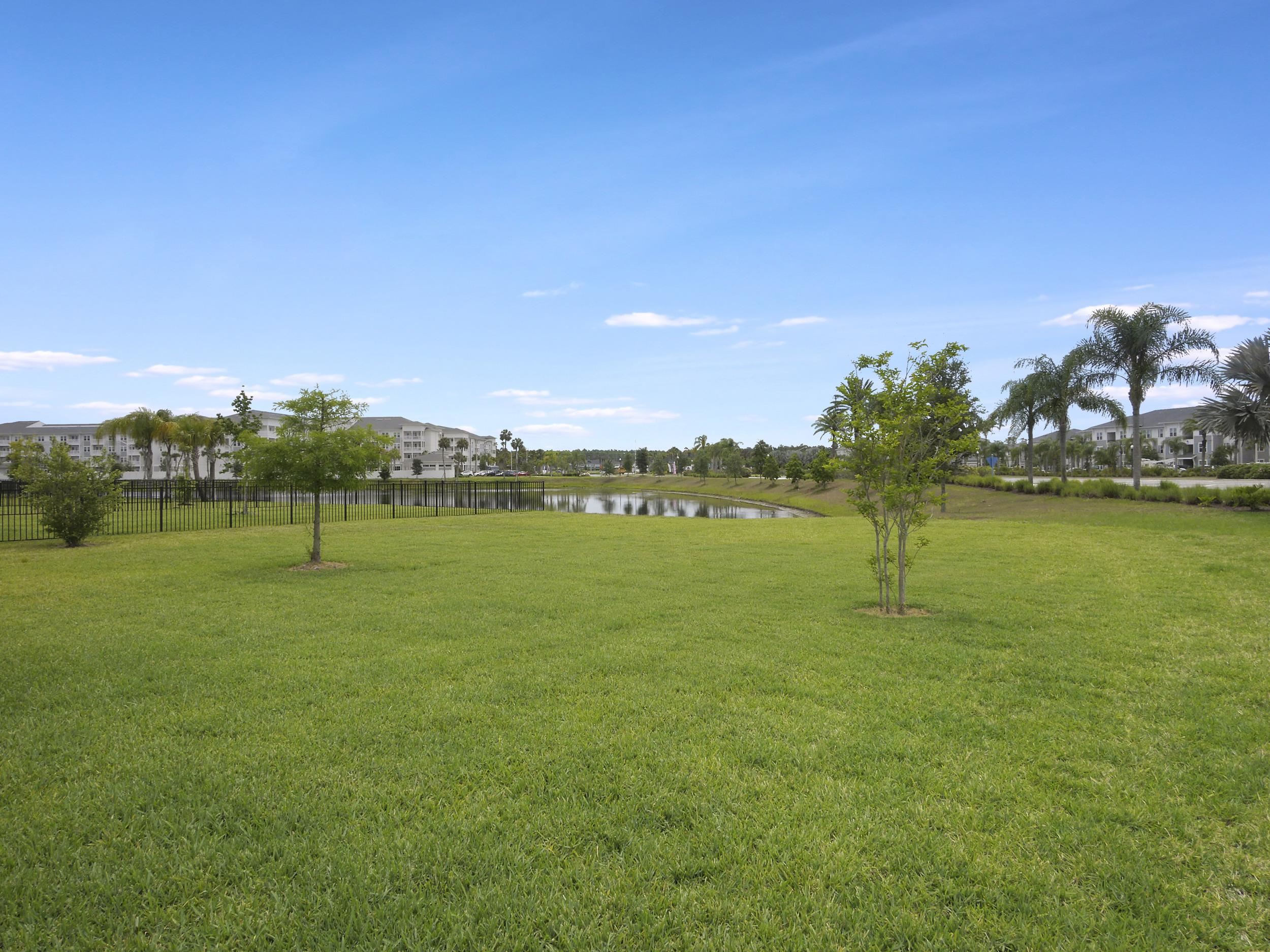 471 Rum Runner Way St. Johns, FL 32259 - Photo 38 of 42 a view of a lake with a big yard