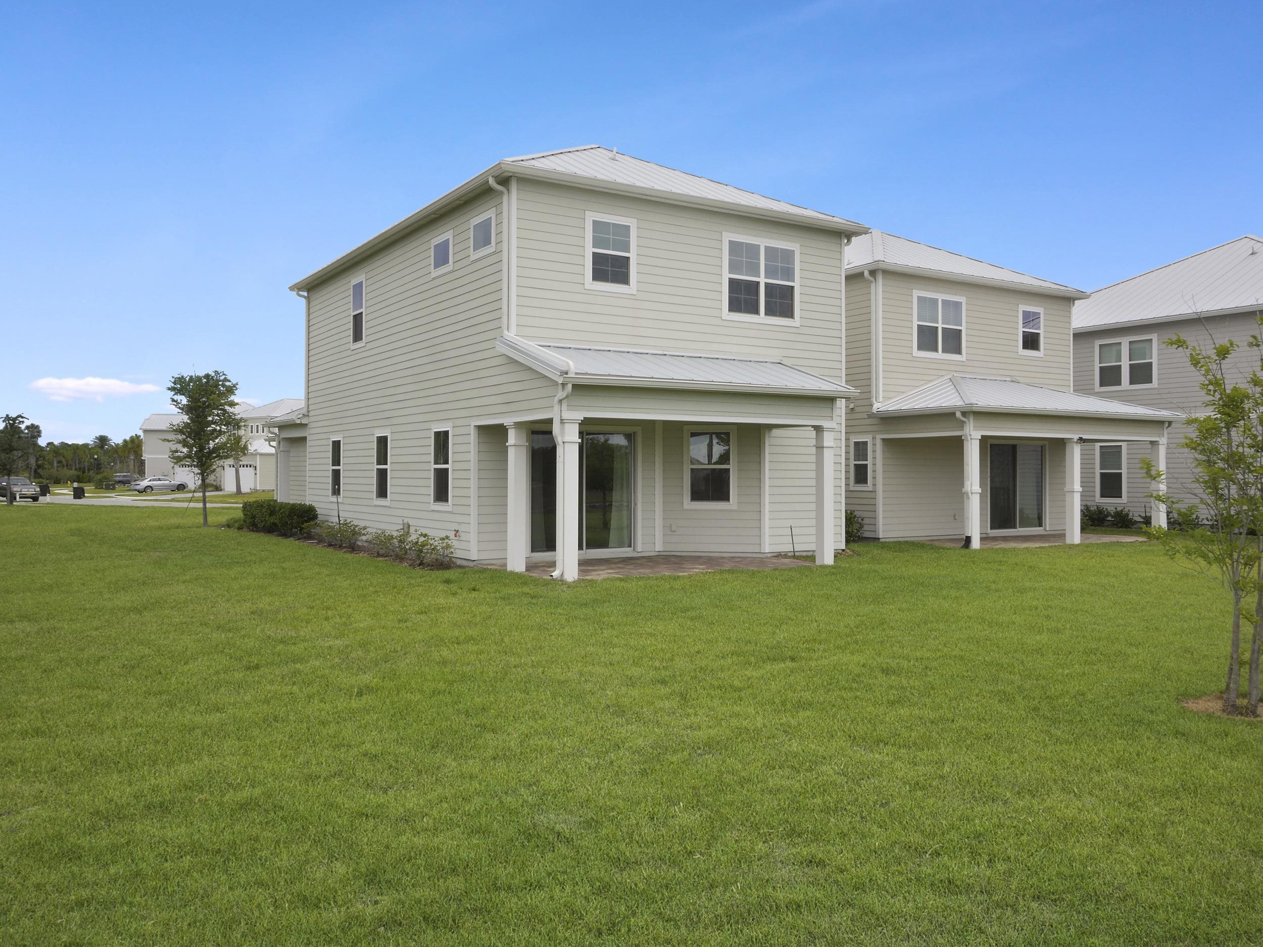 471 Rum Runner Way St. Johns, FL 32259 - Photo 39 of 42 a front view of a house with a garden
