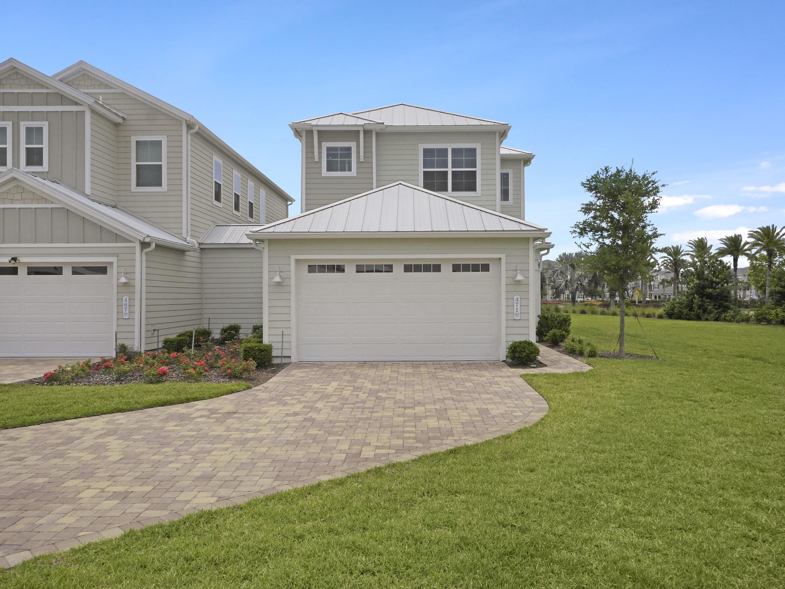 471 Rum Runner Way St. Johns, FL 32259 - Photo 40 of 42 a front view of a house with a yard and garage