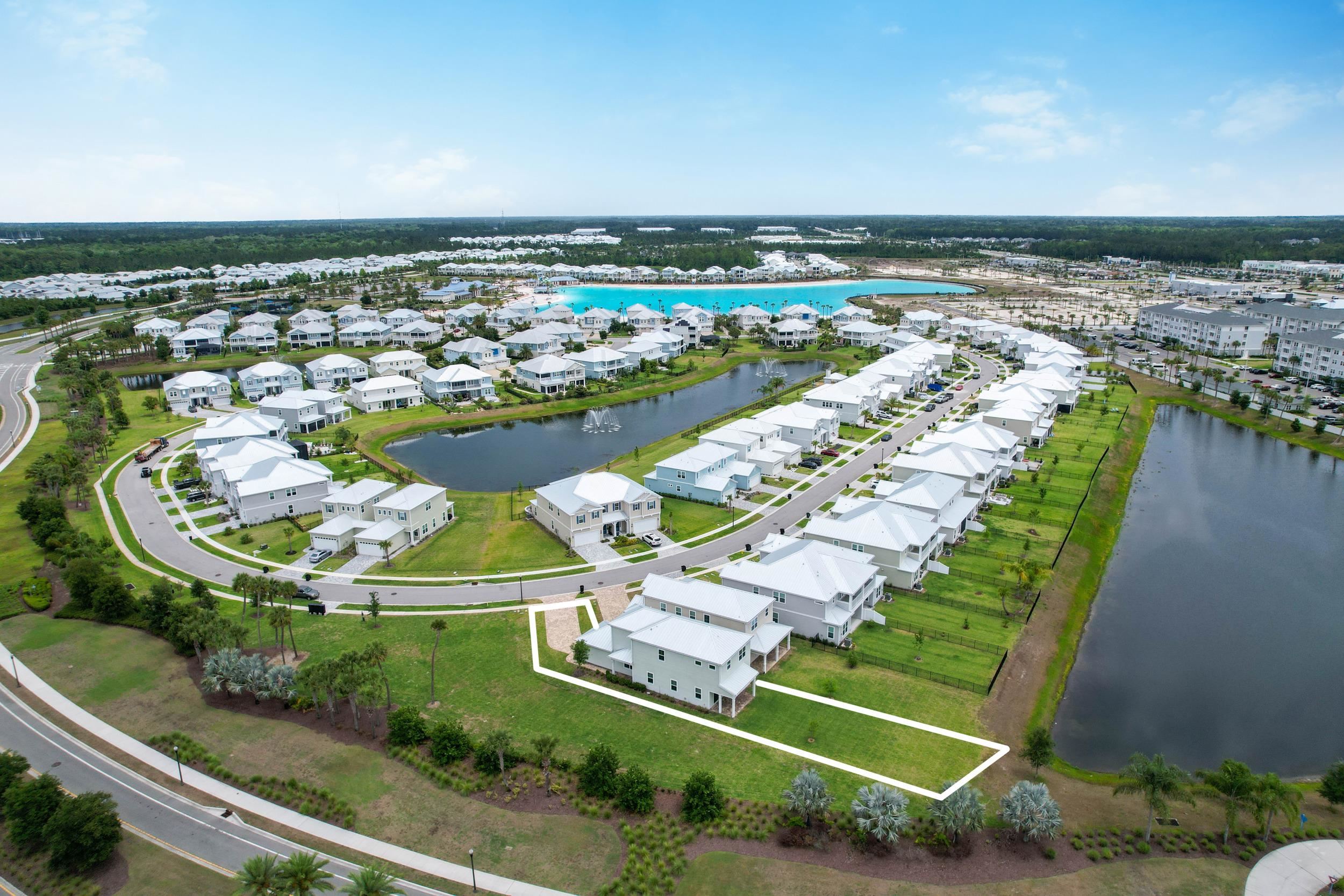 471 Rum Runner Way St. Johns, FL 32259 - Photo 7 of 42 a view of a swimming pool with a garden