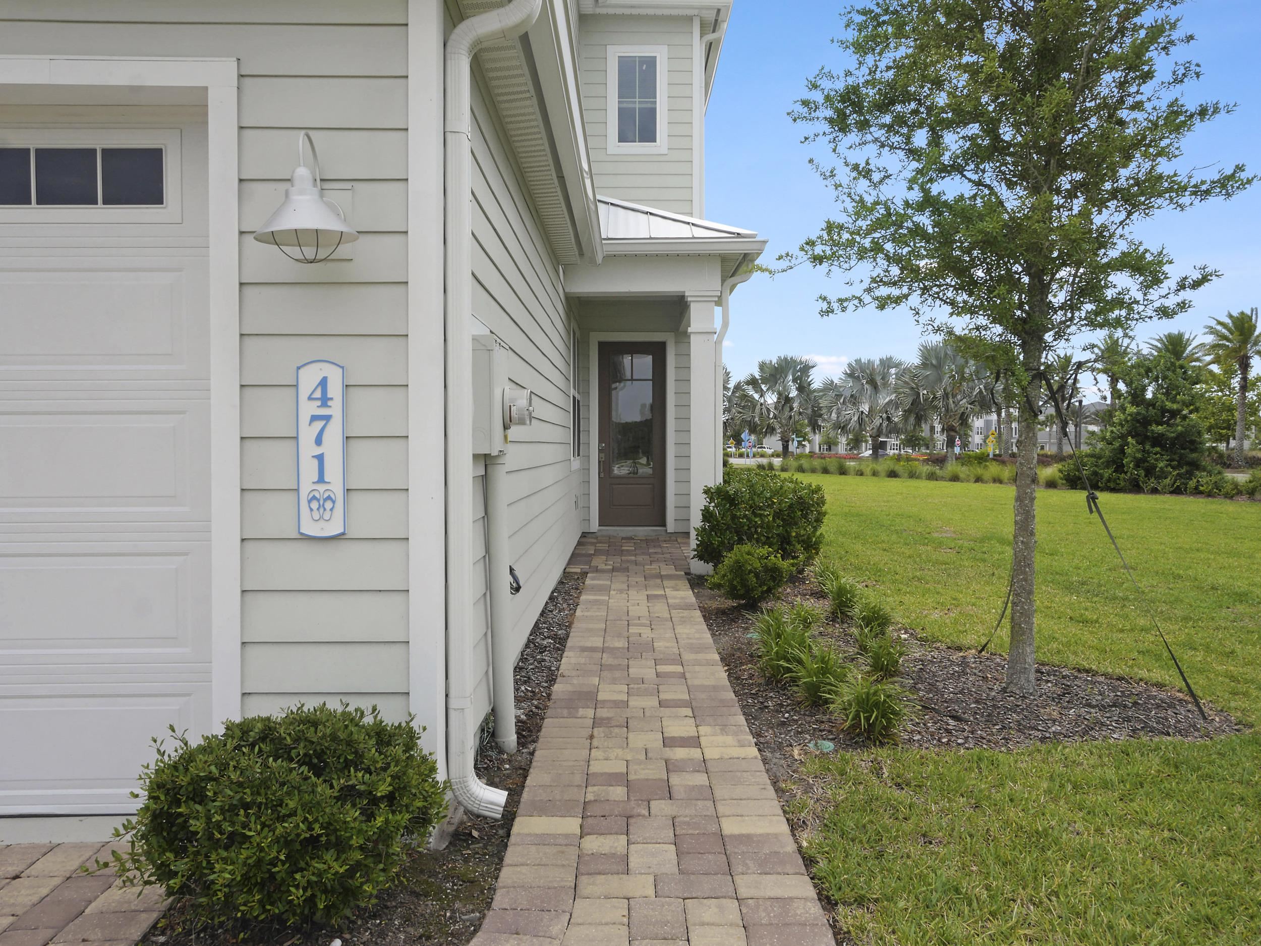 471 Rum Runner Way St. Johns, FL 32259 - Photo 9 of 42 a front view of a house with a yard