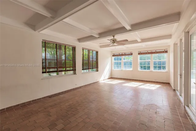 a view of an empty room with glass door