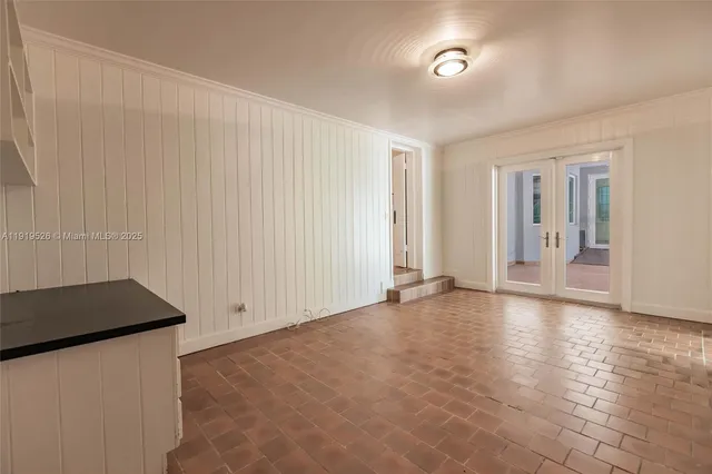 a view of staircase with white walls and a window