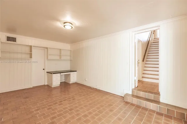 a bathroom with a toilet a sink and a window