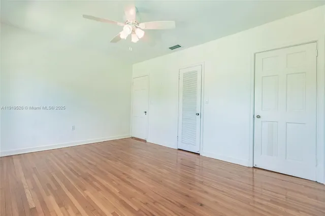 a bathroom with a sink a toilet a mirror and shower