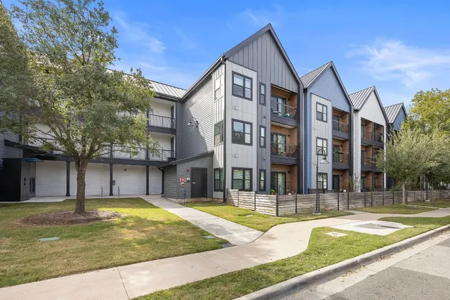 a view of a house with swimming pool and a porch