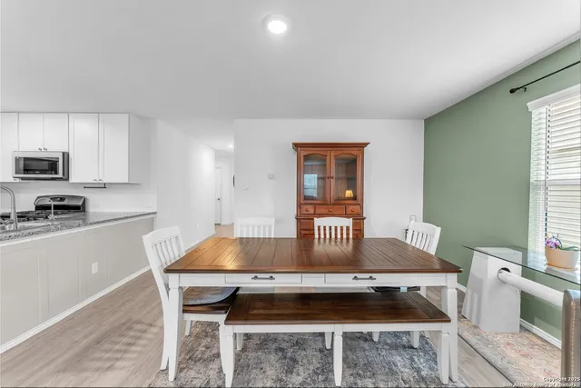 a bedroom with a bed and a ceiling fan