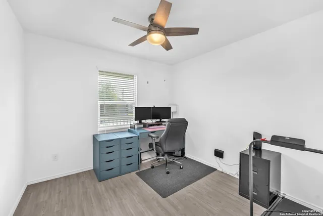 a view of workspace with wooden floor shelves