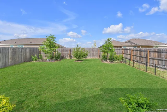 a view of a patio with a table and chairs