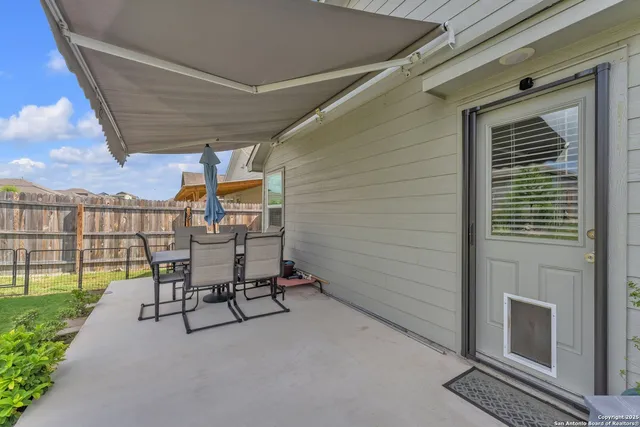 a view of a house with backyard porch and garden