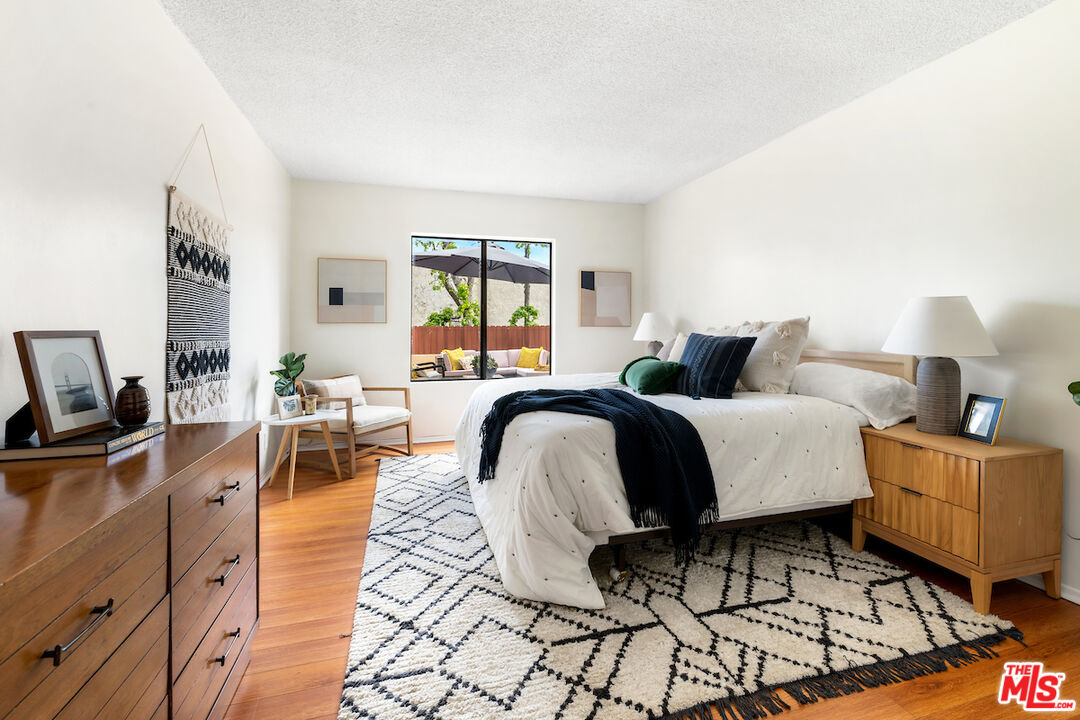 1401 Valley View Road, Unit 118 Glendale, CA 91202 - Photo 14 of 23 a bedroom with a bed a table and chair