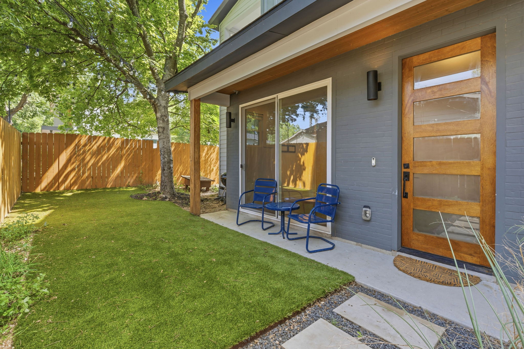 1707 Deloney Street, Unit 2 Austin, TX 78721 - Photo 25 of 26 A well-maintained fenced yard offers a private outdoor oasis with an inviting patio space.