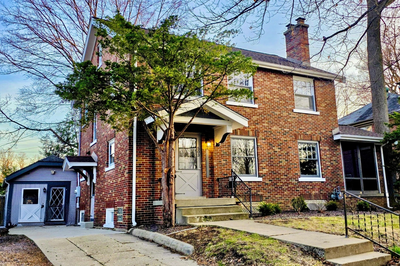 503 East Chestnut Street Bloomington, IL 61701 - Photo 1 of 24 front view of a building with a garden