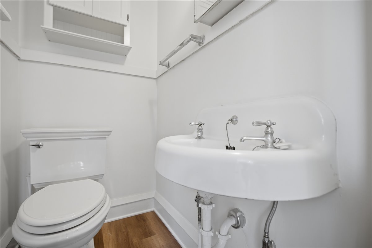 503 East Chestnut Street Bloomington, IL 61701 - Photo 11 of 24 a bathroom with a sink a toilet and mirror