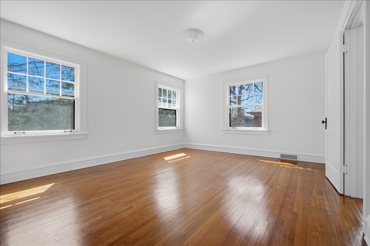 503 East Chestnut Street Bloomington, IL 61701 - Photo 14 of 24 a view of empty room with wooden floor and fan