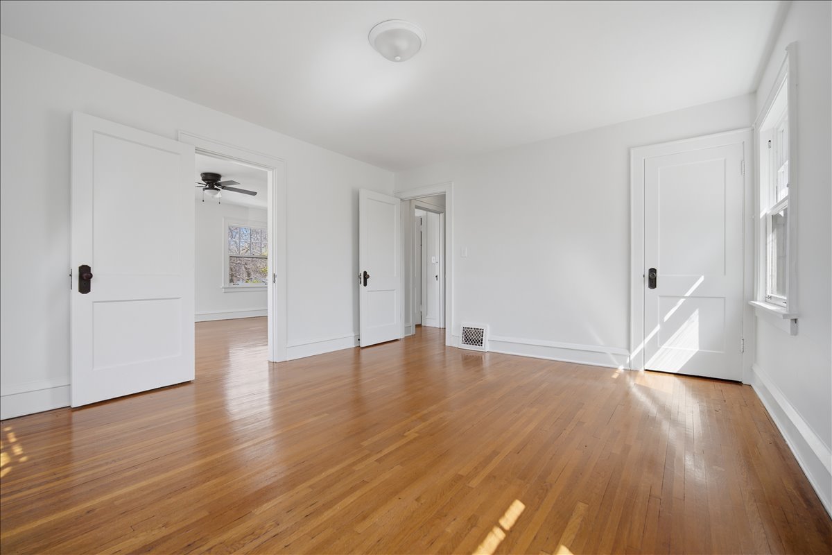 503 East Chestnut Street Bloomington, IL 61701 - Photo 15 of 24 an empty room with wooden floor and a window
