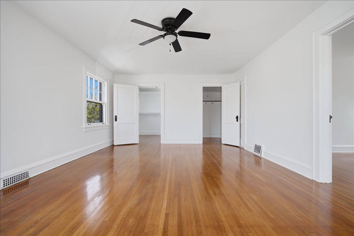 503 East Chestnut Street Bloomington, IL 61701 - Photo 16 of 24 a view of empty room with wooden floor and ceiling fan
