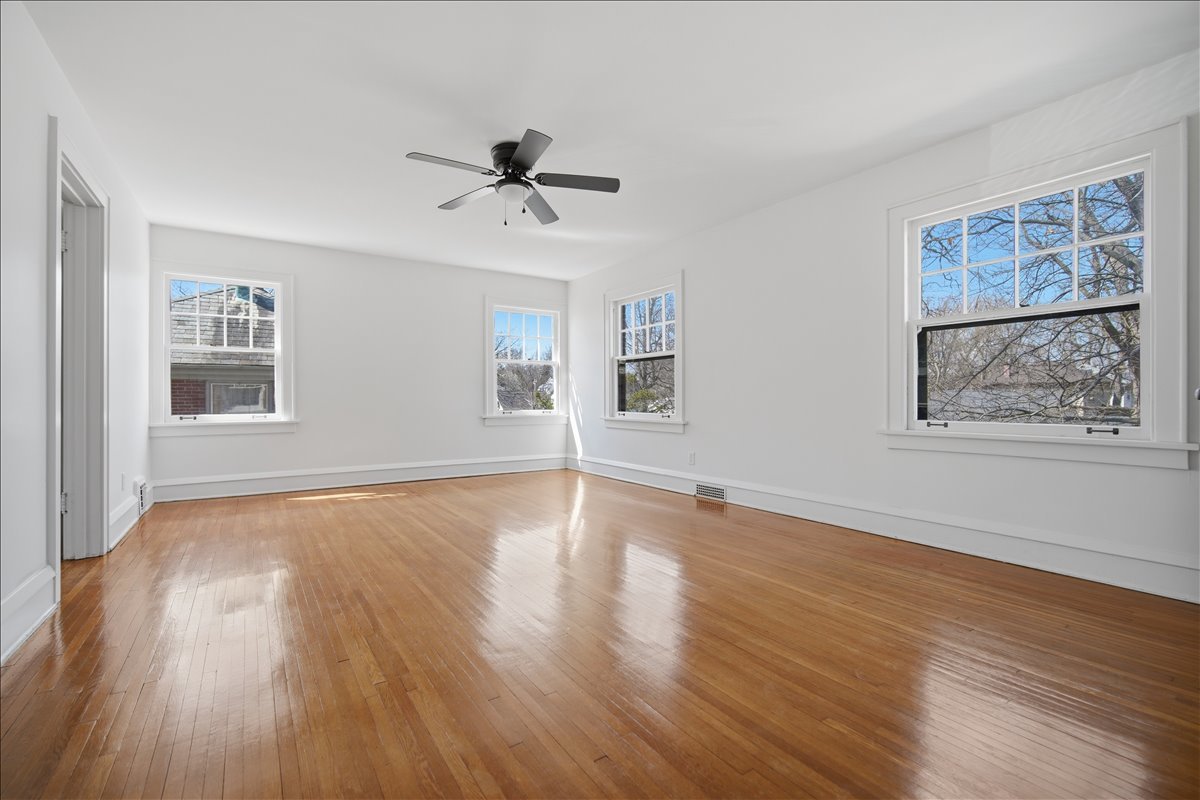 503 East Chestnut Street Bloomington, IL 61701 - Photo 17 of 24 a view of empty room with wooden floor and fan