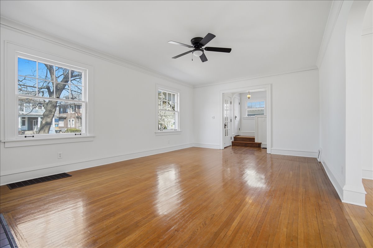 503 East Chestnut Street Bloomington, IL 61701 - Photo 7 of 24 a view of empty room with wooden floor and fan