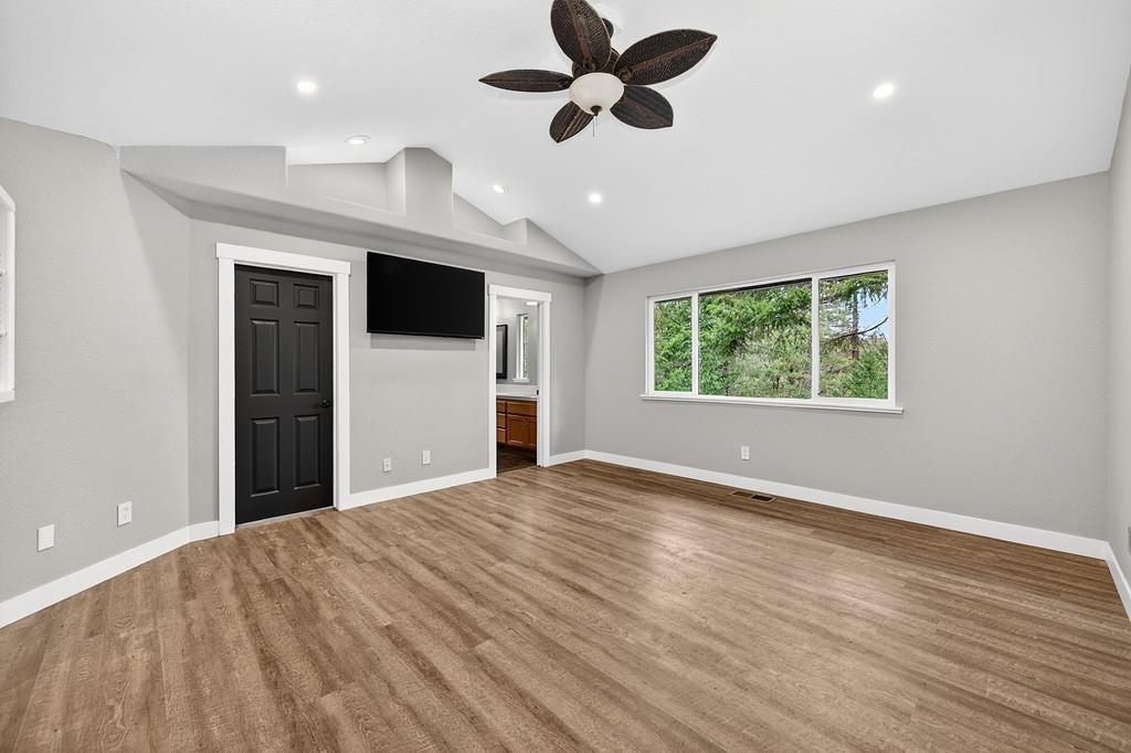 1149 Swanson Lane Colfax, CA 95713 - Photo 18 of 52 a view of an empty room with a window and a ceiling fan
