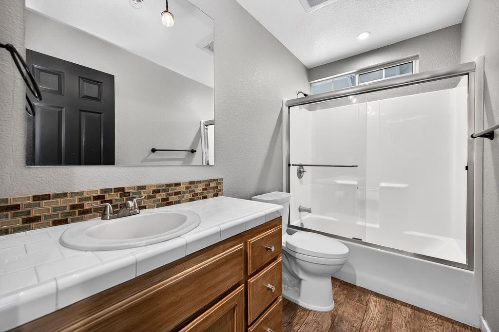 1149 Swanson Lane Colfax, CA 95713 - Photo 23 of 52 a bathroom with a sink toilet double vanity and shower