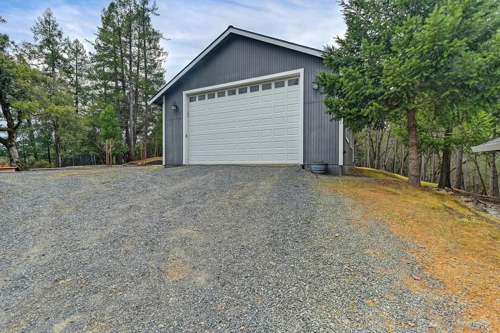 1149 Swanson Lane Colfax, CA 95713 - Photo 6 of 52 a view of a house with a yard and garage