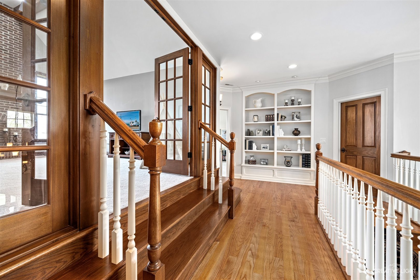 1749 Hunters Ridge Lane Sugar Grove, IL 60554 - Photo 18 of 45 a view of a hallway with wooden floor and staircase