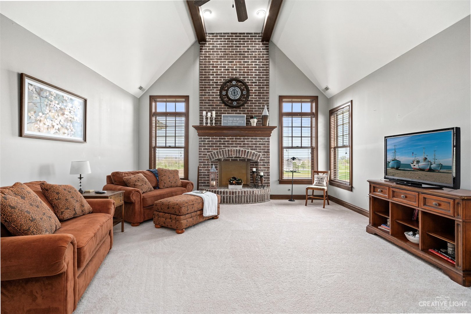 1749 Hunters Ridge Lane Sugar Grove, IL 60554 - Photo 19 of 45 a living room with furniture and a fireplace