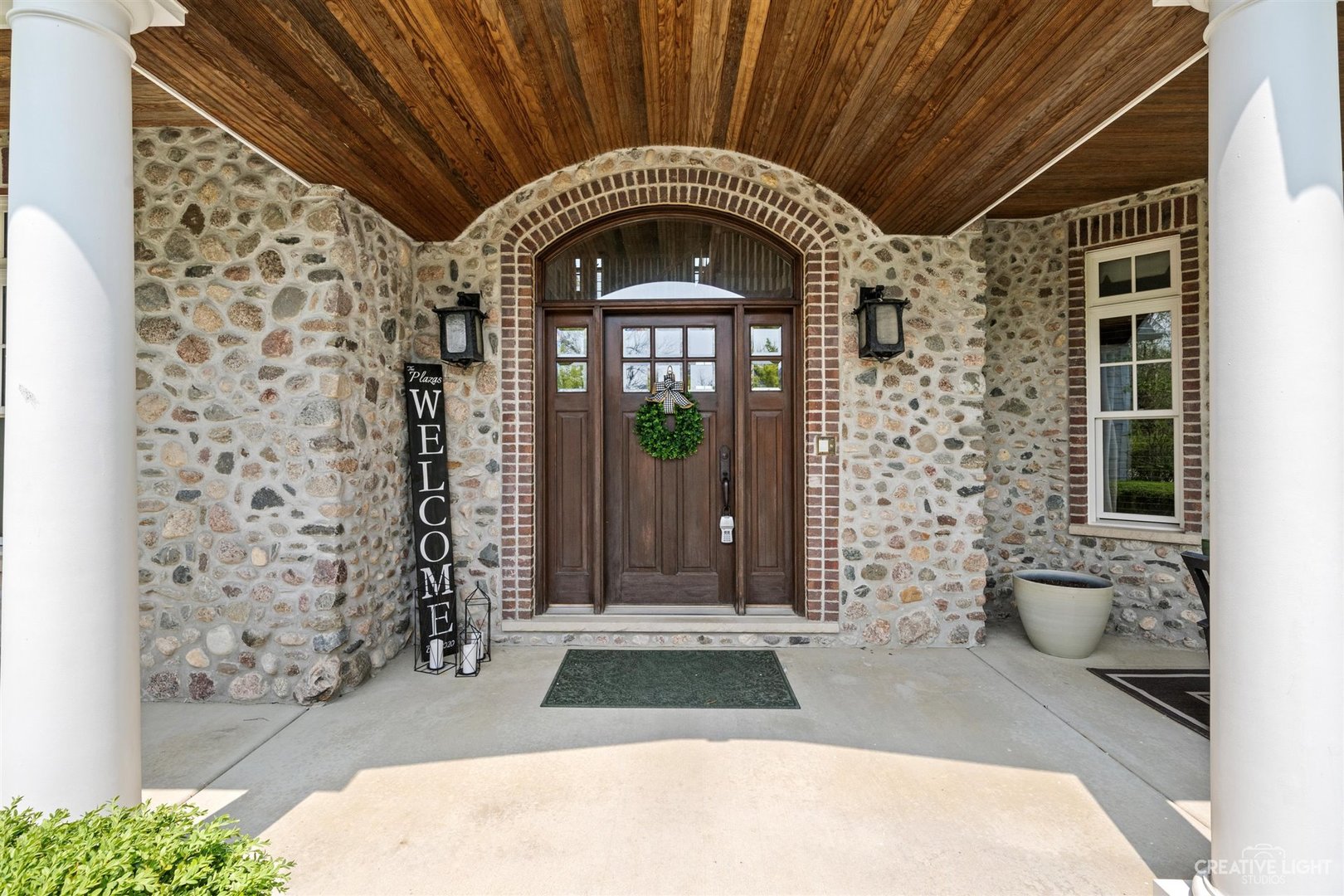 1749 Hunters Ridge Lane Sugar Grove, IL 60554 - Photo 3 of 45 a front view of a house with a garden