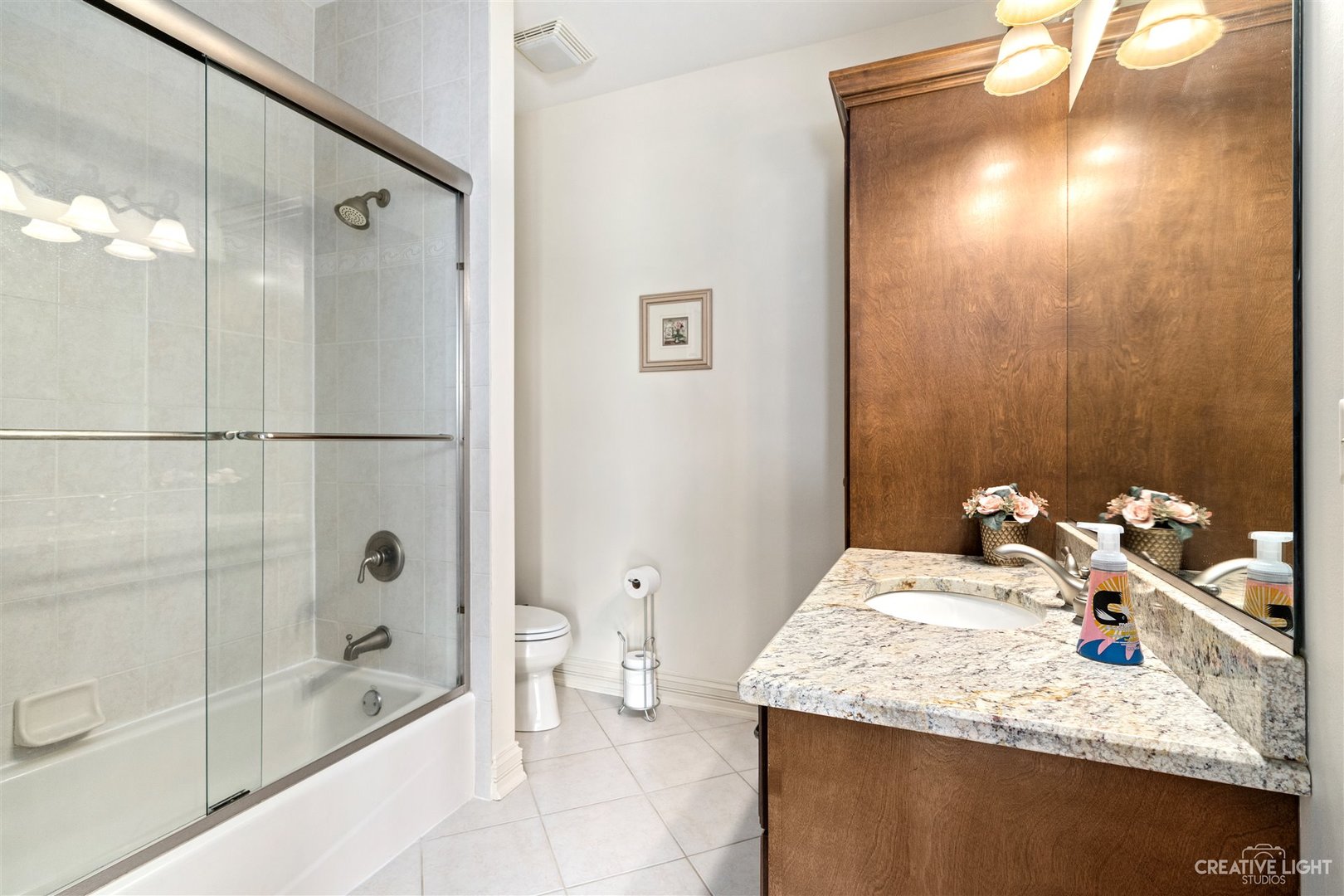 1749 Hunters Ridge Lane Sugar Grove, IL 60554 - Photo 32 of 45 a bathroom with a granite countertop sink a shower and a mirror