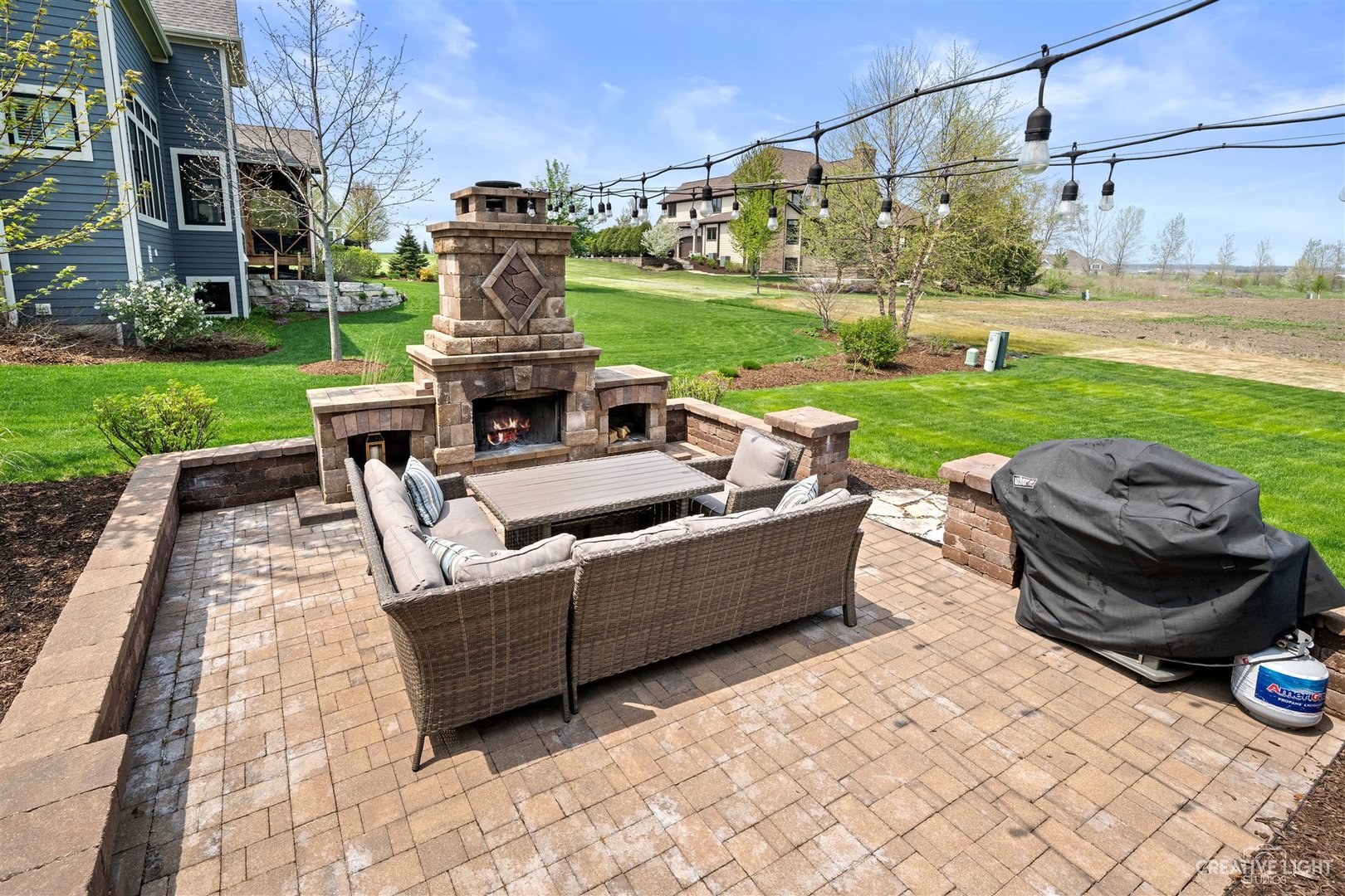 1749 Hunters Ridge Lane Sugar Grove, IL 60554 - Photo 36 of 45 a view of a patio with couches chairs and a fire pit