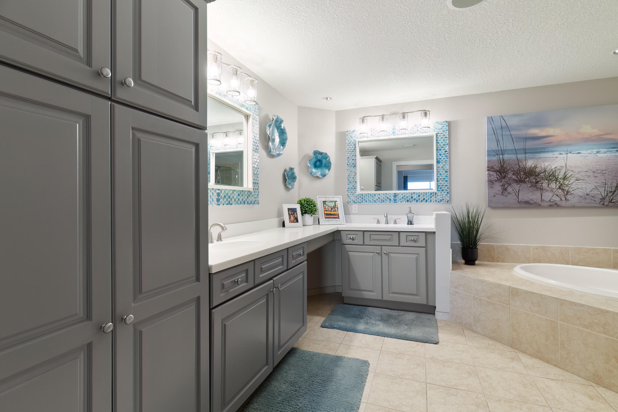 770 Harbor Boulevard, Unit 7E Destin, FL 32541 - Photo 16 of 50 a spacious bathroom with a double vanity sink a mirror and a bathtub