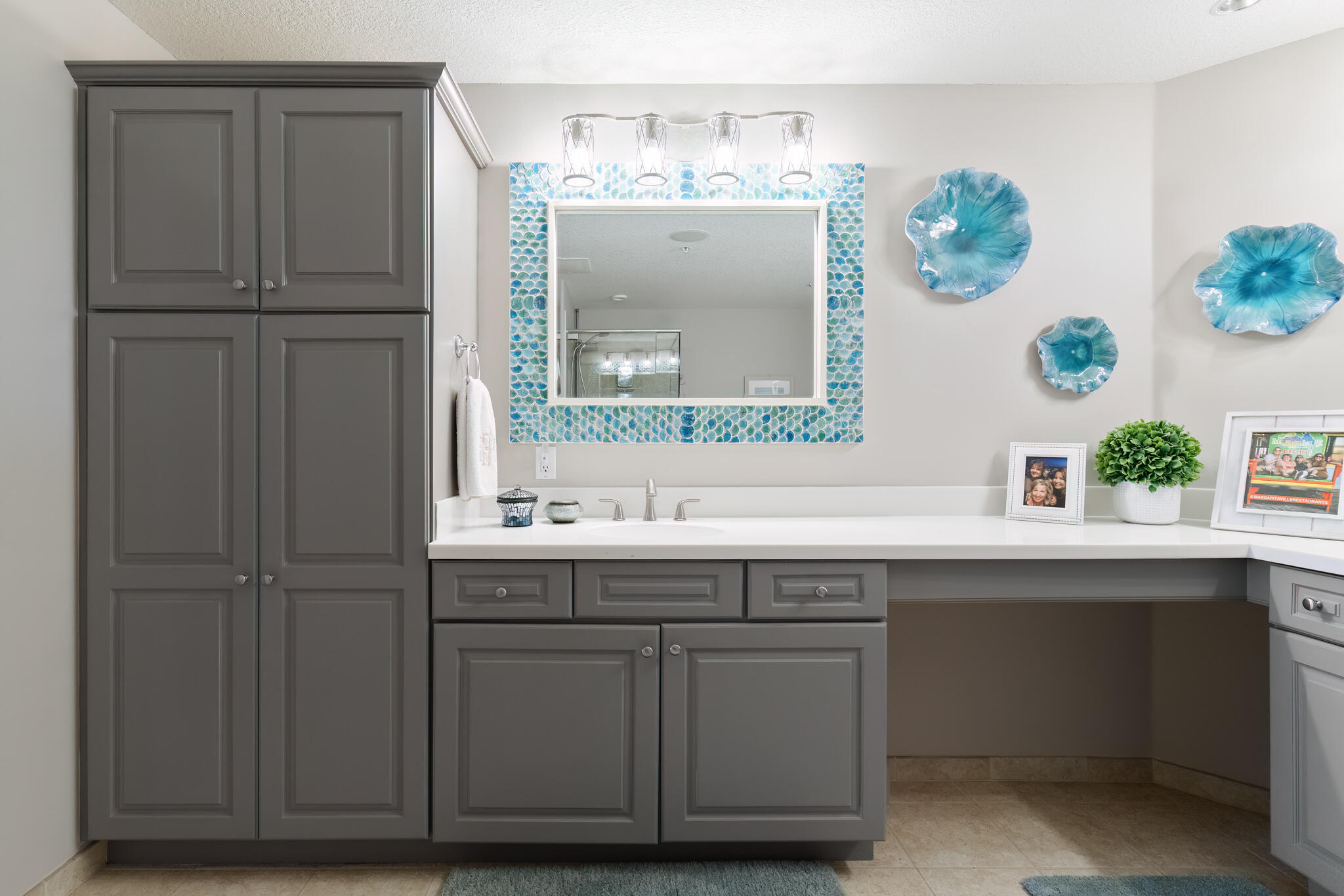 770 Harbor Boulevard, Unit 7E Destin, FL 32541 - Photo 17 of 50 a bathroom with a sink a mirror and a window