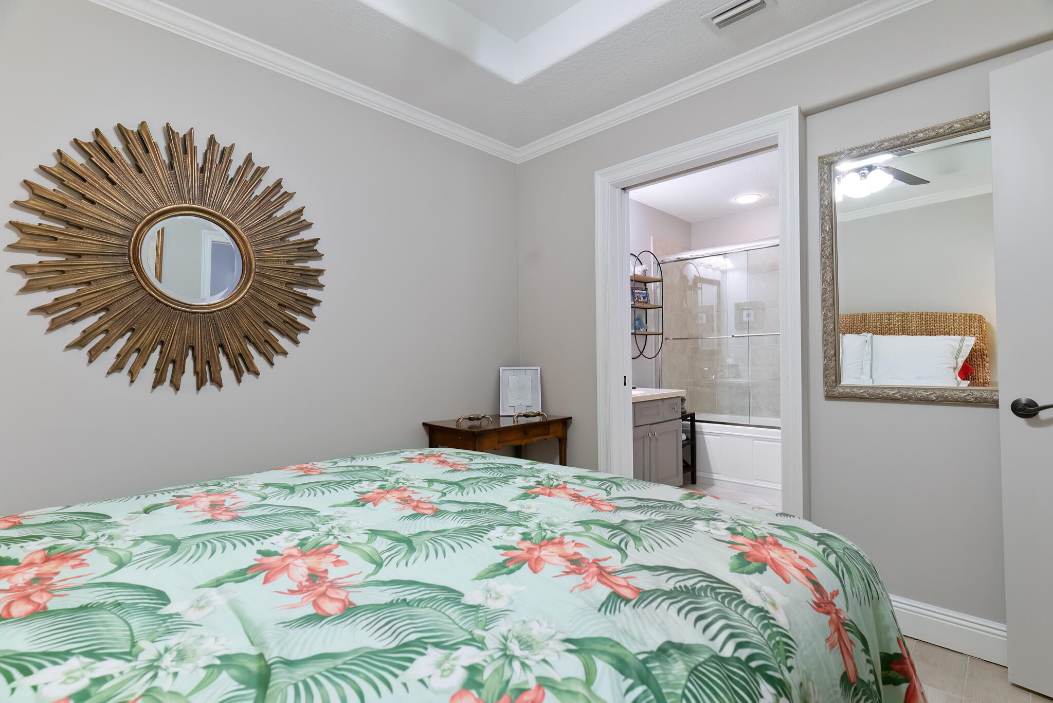 770 Harbor Boulevard, Unit 7E Destin, FL 32541 - Photo 27 of 50 a bedroom with a bed and a chandelier
