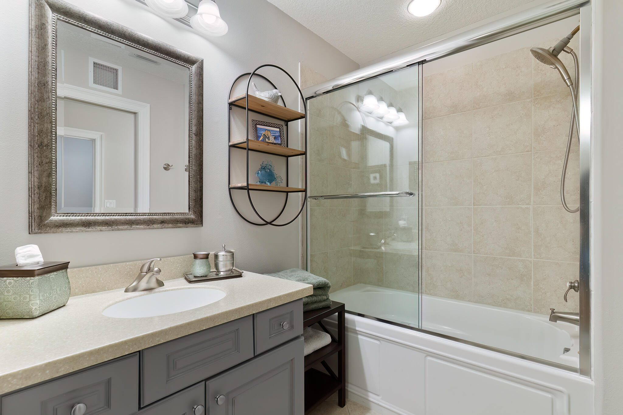 770 Harbor Boulevard, Unit 7E Destin, FL 32541 - Photo 28 of 50 a bathroom with a granite countertop sink mirror toilet and shower