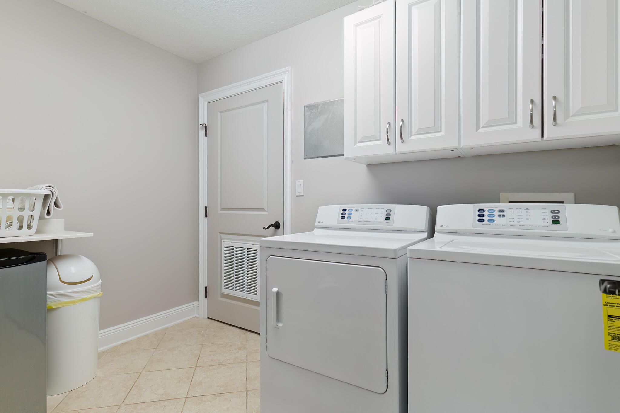 770 Harbor Boulevard, Unit 7E Destin, FL 32541 - Photo 31 of 50 a utility room with dryer and washer