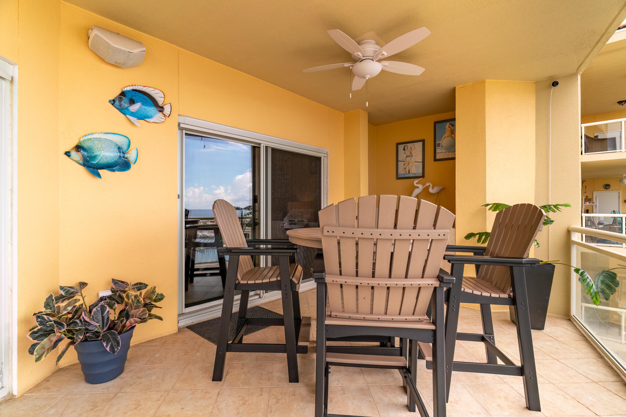770 Harbor Boulevard, Unit 7E Destin, FL 32541 - Photo 32 of 50 a view of a dining room with furniture and a chandelier