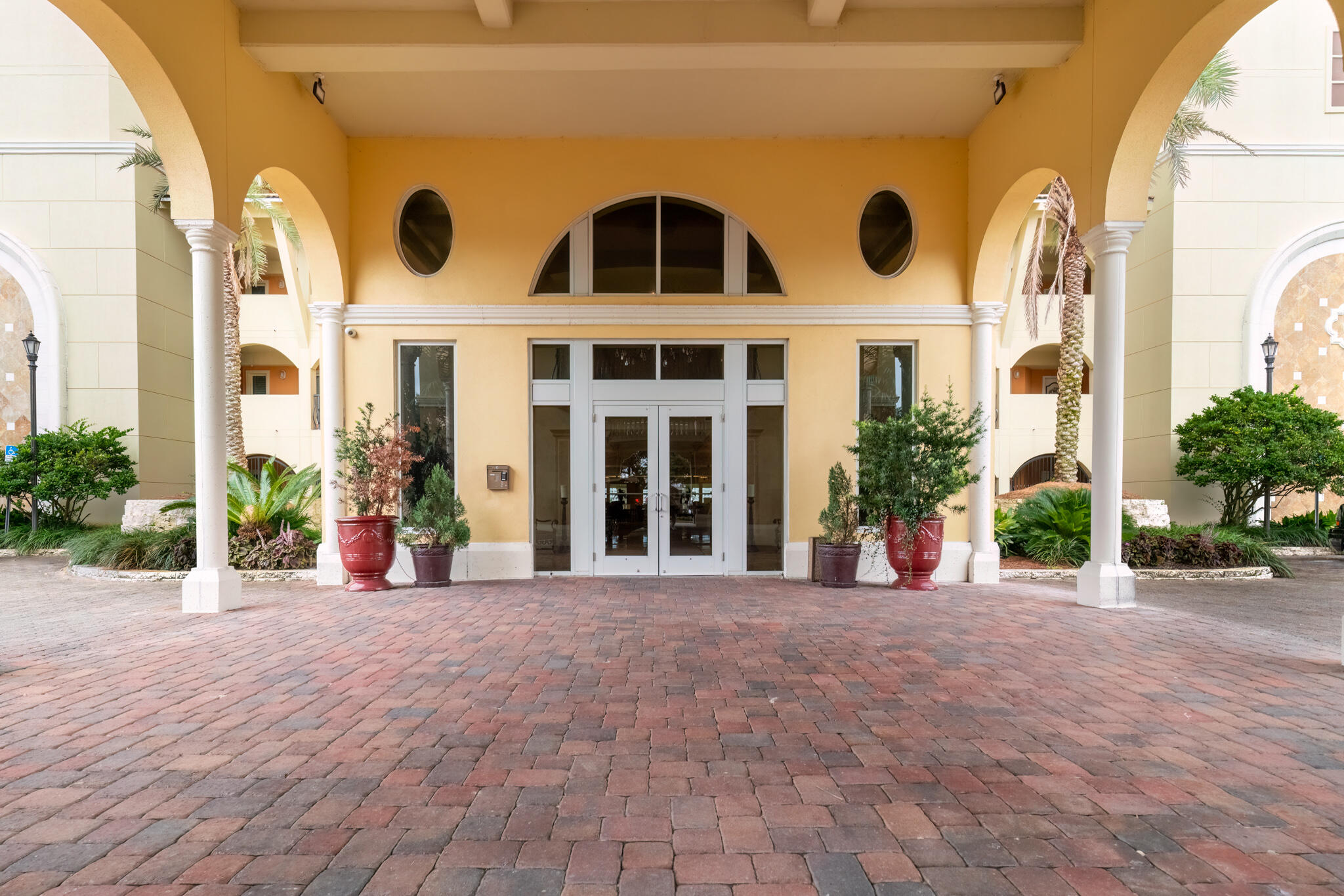 770 Harbor Boulevard, Unit 7E Destin, FL 32541 - Photo 40 of 50 a view of a building with potted plants